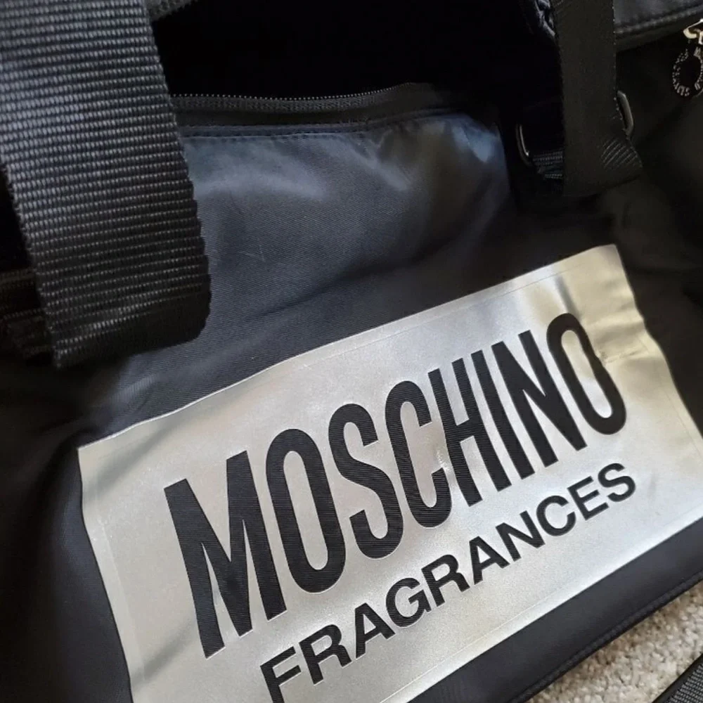 Moschino Black Duffel Bag with Silver Logo Patch